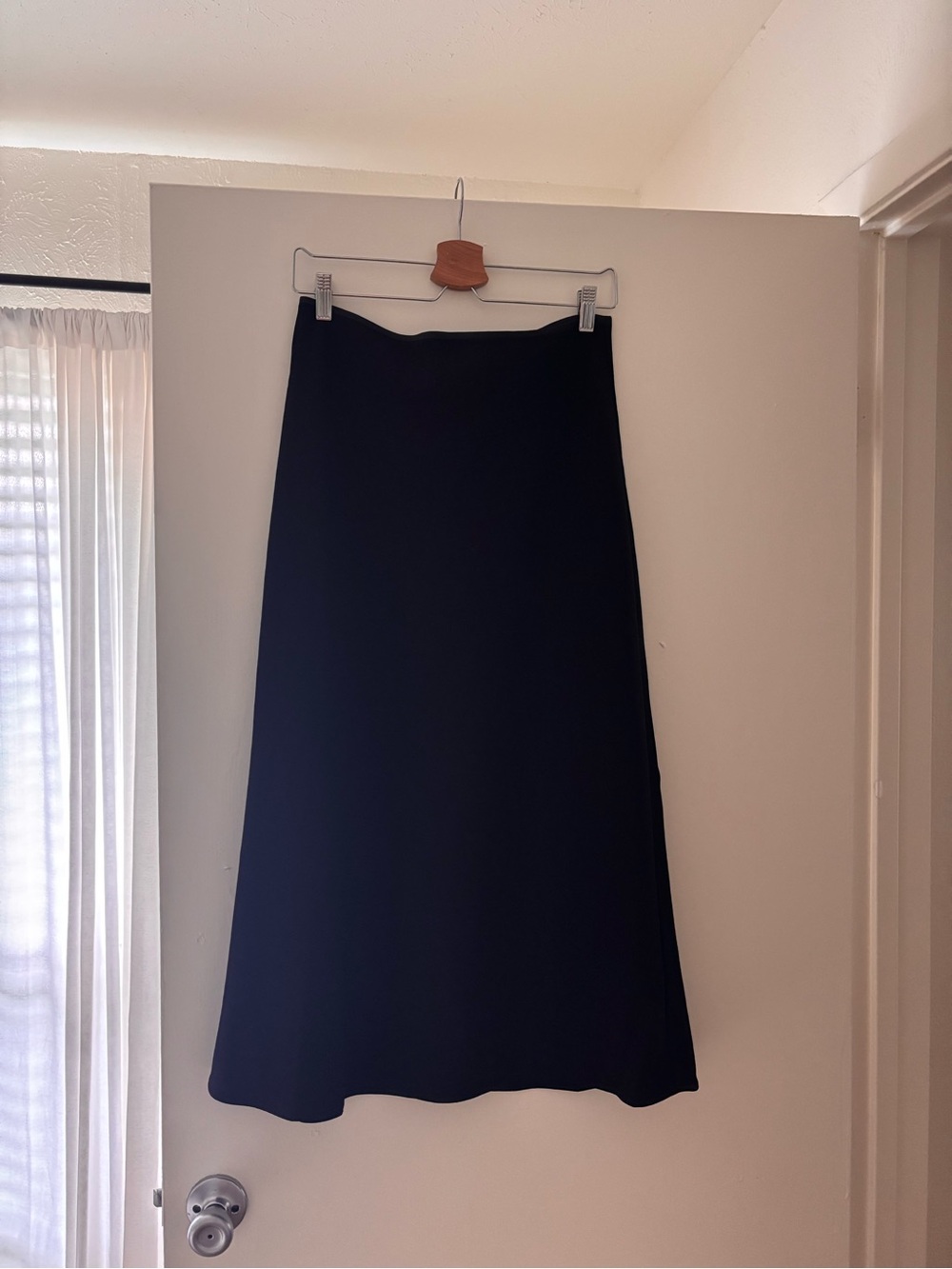 Aritzia Black Midi Skirt - Sleek A-Line Silhouette